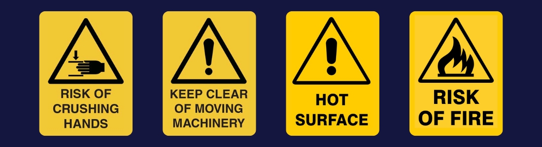 Warning signs on a CNC plasma workshop.